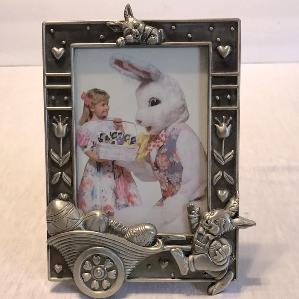 Silver metal rabbit with wheel barrel of eggs picture frame.